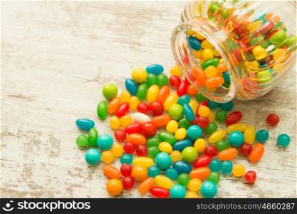 Glass bowl fallen with colorful jelly beans