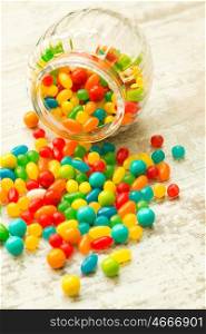 Glass bowl fallen with colorful jelly beans