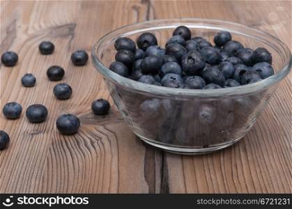 Glass Bowl of Blueberries on Wooden Table