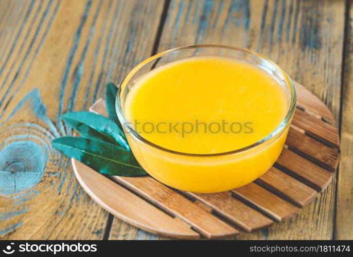 Glass bowl of homemade lemon curd close up