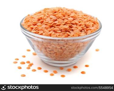 Glass bowl of peeled red lentils isolated on white