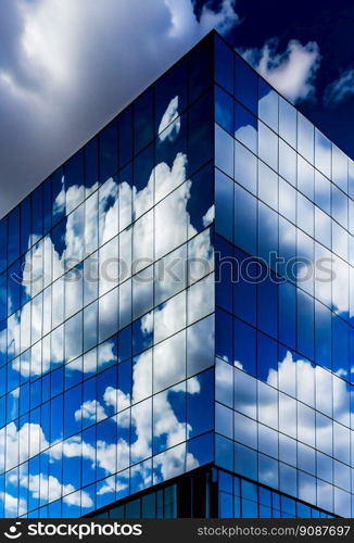 Glass building under blue sky and white clouds.  Generative AI 