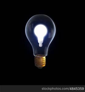 Glass bulb. Glass glowing light bulb on black background