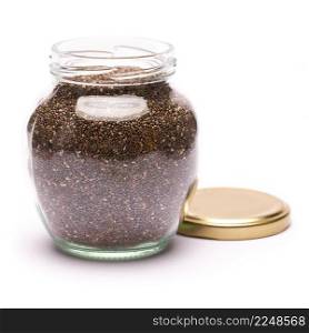 glass can full of organic natural chia seeds close-up isolated on white background. High quality studio photo. glass can full of organic natural chia seeds close-up isolated on white background