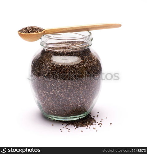 glass can full of organic natural chia seeds close-up isolated on white background. High quality studio photo. glass can full of organic natural chia seeds close-up isolated on white background