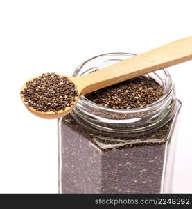 glass can full of organic natural chia seeds close-up isolated on white background. High quality studio photo. glass can full of organic natural chia seeds close-up isolated on white background