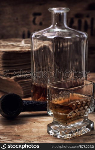 glass carafe with alcoholic drink of whiskey vintage style