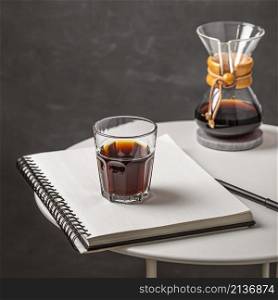 glass coffee with notebook pen