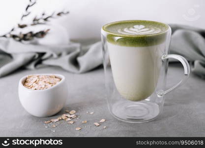 glass cup of fresh matcha latte and oatmeal