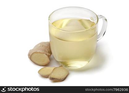 Glass cup of ginger tea on white background
