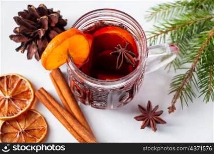 Glass cup with mulled wine on a white background. Winter warming drink.. Glass cup with mulled wine on white background. Winter warming drink.