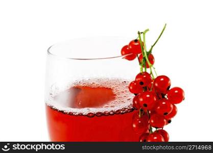 Glass cup with red currant juice isolated on white