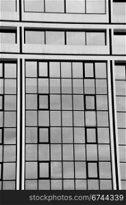 Glass facade squares modern building architectural detail. Black and white.