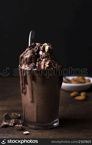 glass filled with chocolate ice cream dessert