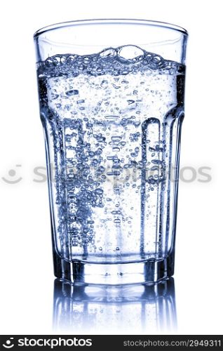 Glass filled with sparkling water. Isolated on white background