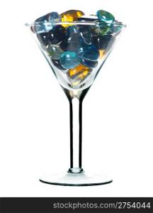 Glass for martini with colour glass stones. It is isolated on a white background