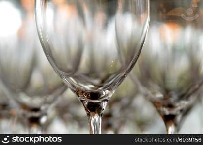 Glass glasses for wine standing on the table. Wine glass close-up