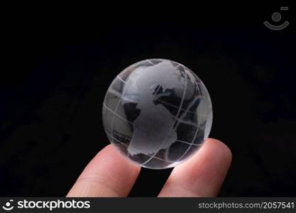Glass globe for environment and conservation. Global business or education concepts