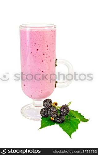Glass goblet with a milkshake, berry and green leaf blackberry isolated on white background