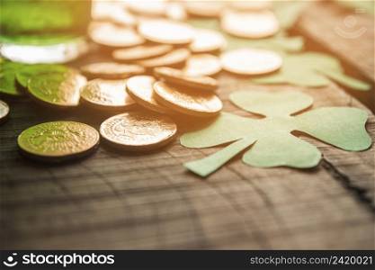 glass green drink near heap coins paper shamrocks table