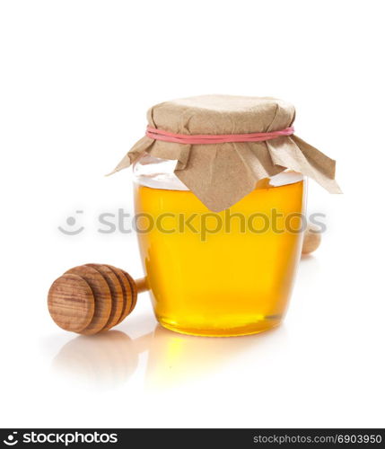 glass jar of honey isolated on white background