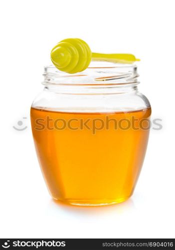 glass jar of honey isolated on white background