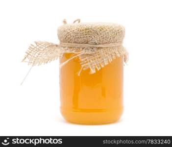 glass jar of honey on white background