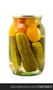 Glass jar of preserved gherkins and tomatoes isolated on a white background