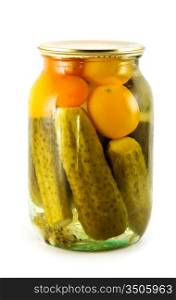 Glass jar of preserved gherkins and tomatoes isolated on a white background