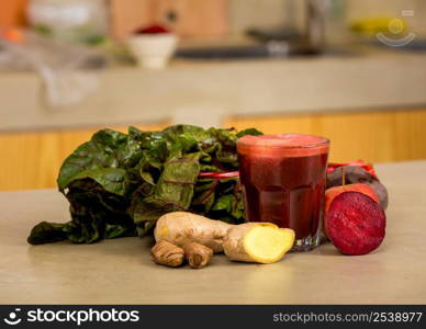 Glass jar of red juice, a detox beverage.