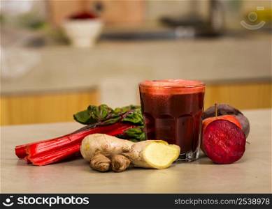 Glass jar of red juice, a detox beverage.