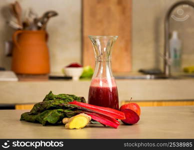 Glass jar of red juice, a detox beverage.