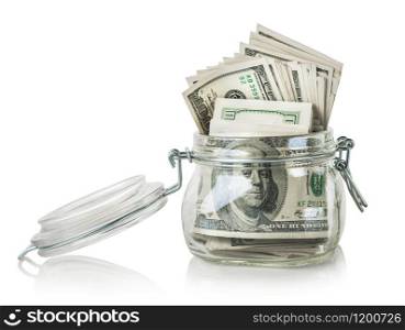 Glass jar with dollars isolated on a white background. Glass jar with dollars