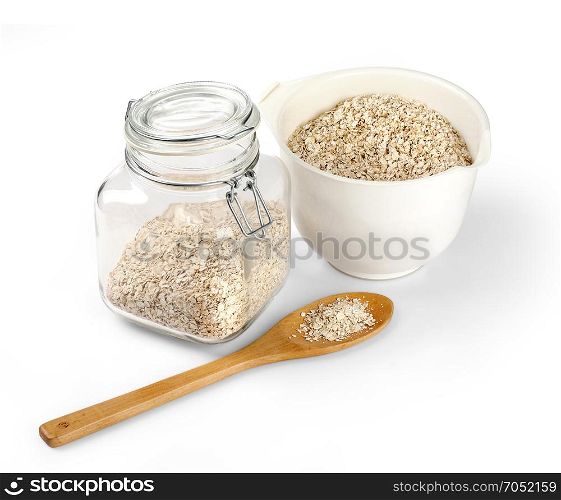 Glass jar with oatmeal flakes isolated on white background with clipping path