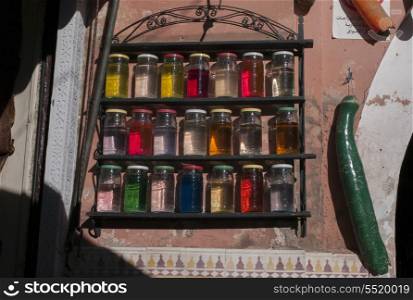 Glass jars filled with colorful liquid, Marrakesh, Morocco
