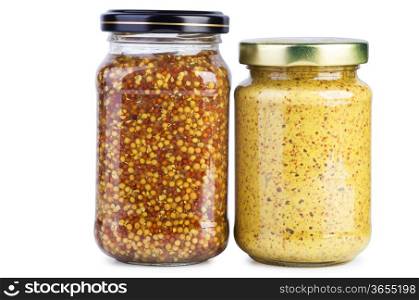 Glass jars with mustard on the white background