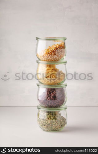 glass jars with pasta, lentils, beans and corn. Zero waste, Recycling, Sustainable lifestyle concept. glass jars with pasta, lentils, beans and corn