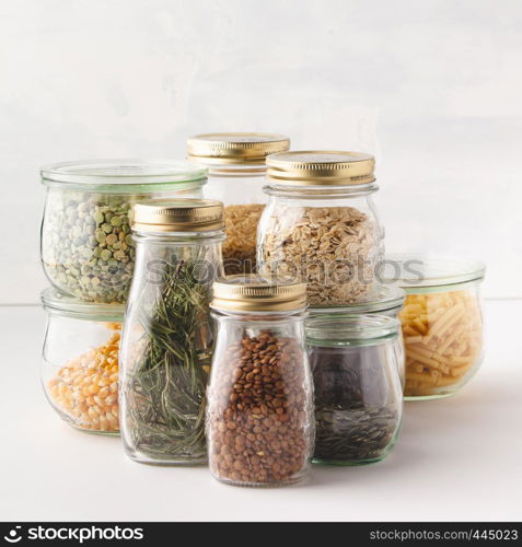 glass jars with pasta, lentils, beans, rice, dry herbs. Zero waste, Recycling, Sustainable lifestyle concept. Zero waste shopping, Recycling, Sustainable eco-friendly lifestyle concept