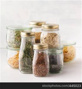 glass jars with pasta, lentils, beans, rice, dry herbs. Zero waste, Recycling, Sustainable lifestyle concept. Zero waste shopping, Recycling, Sustainable eco-friendly lifestyle concept