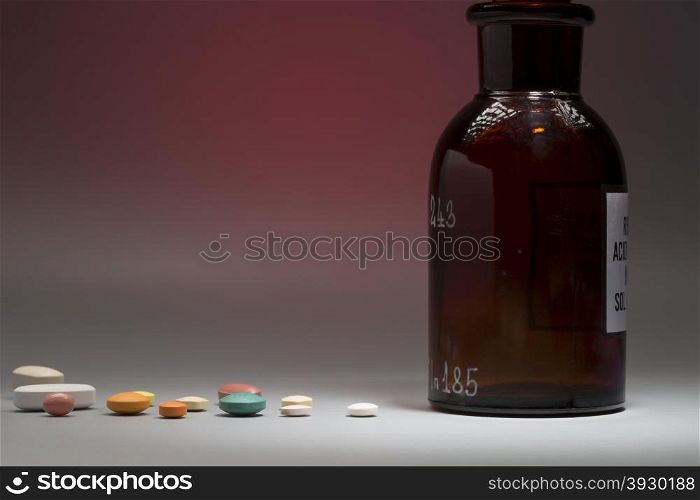 Glass medical bottle with copy space. Glass medical bottle with copy space on a colorful background