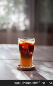 Glass of americano mixed with orange juice, stock photo