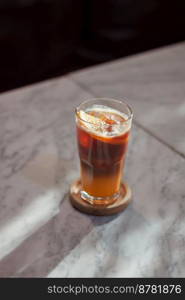 Glass of americano mixed with orange juice, stock photo