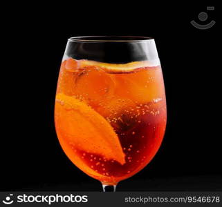 glass of aperol spritz cocktail on black background