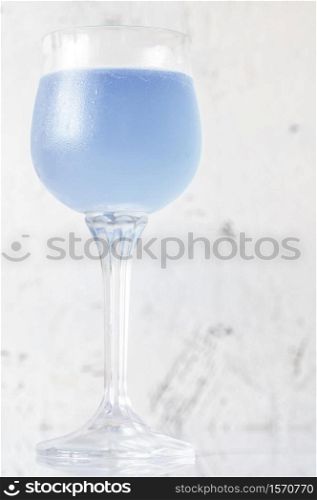 Glass of Aviation cocktail on white background