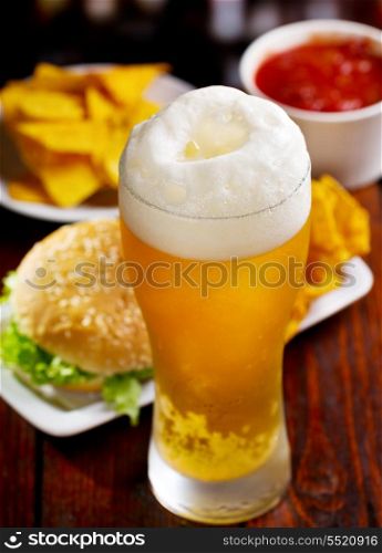 glass of beer and different snack