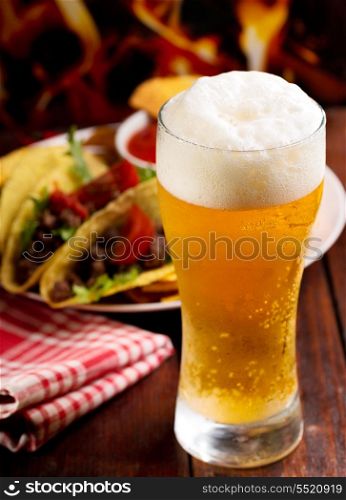 glass of beer and different snack