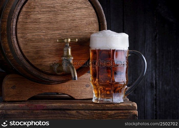 Glass of beer and v∫a≥wooden beer barrel still life