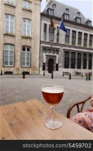 Glass of beer on table in street restaurant, Antwerpen, Belgium&#xA;