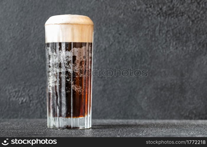 Glass of black velvet cocktail made from a combination of stout and champagne