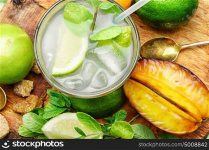 glass of citrus juice. summer refreshing cocktail of fresh lime juice,orange and averrhoa